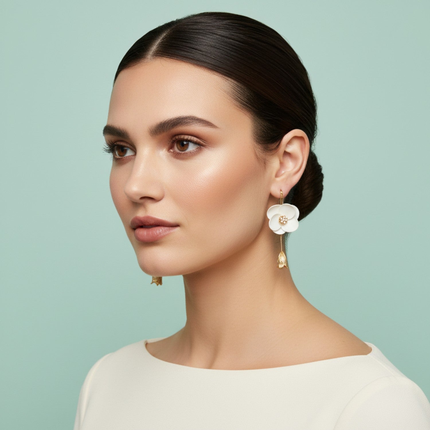 Handmade white bridal earrings styled with a wedding up-do