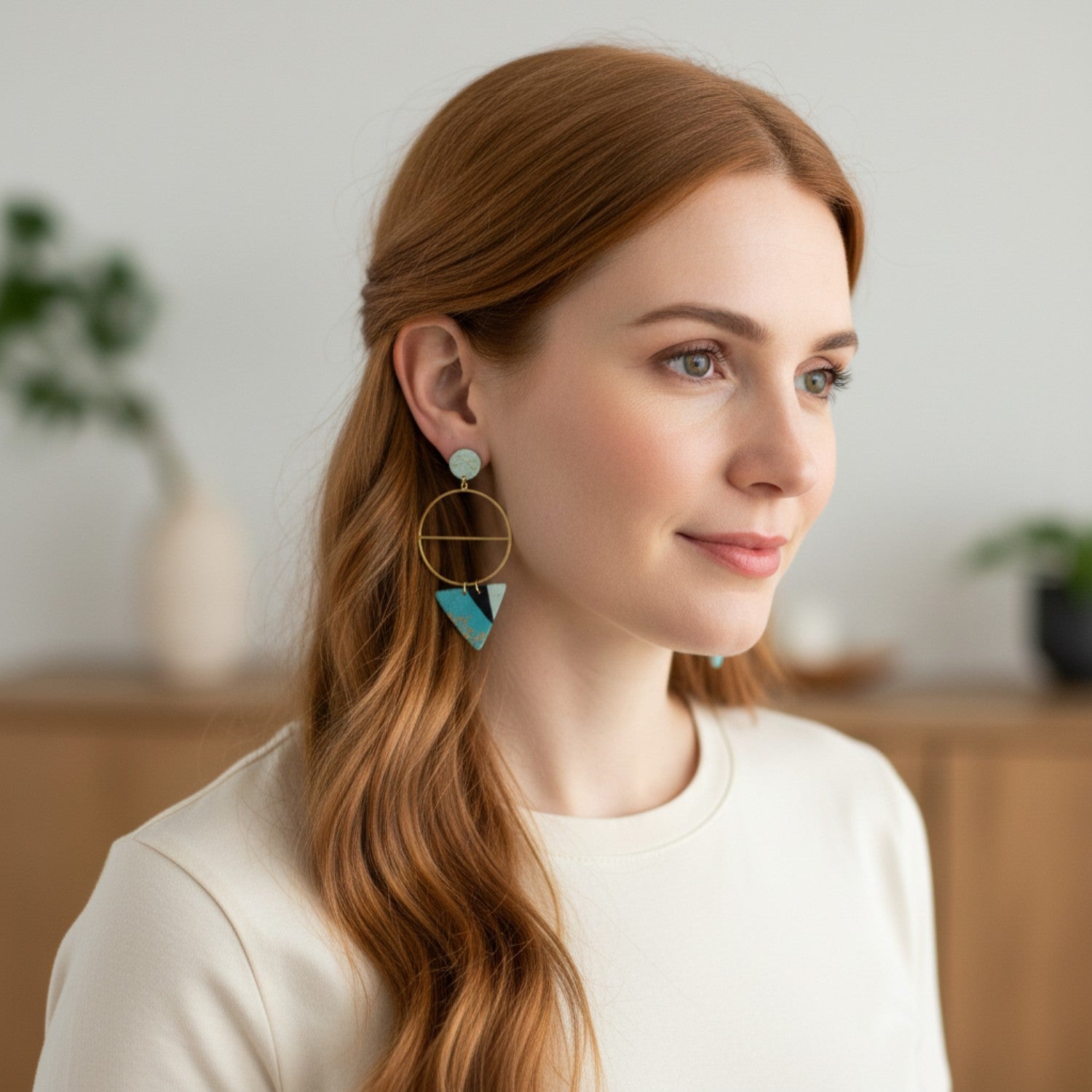 Woman wearing earrings with a blurred indoor background