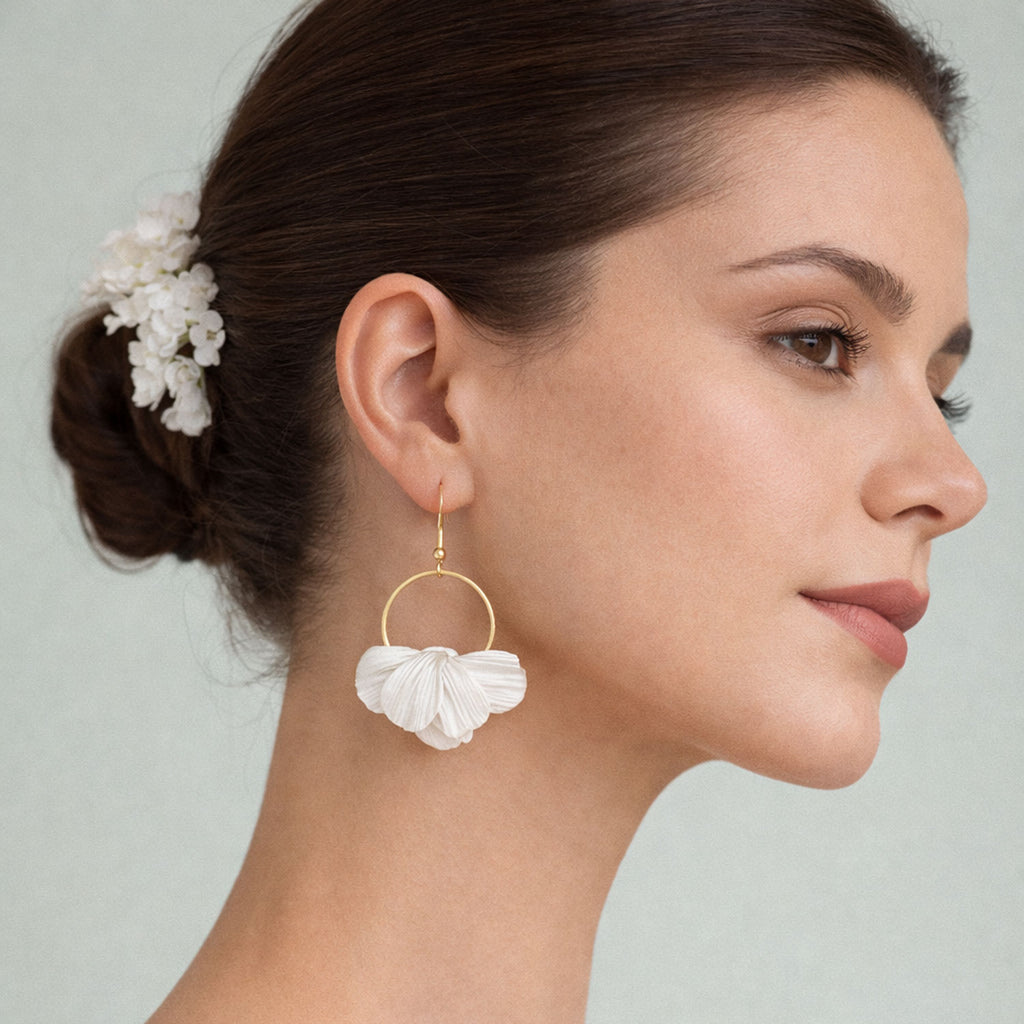Woman wearing a Flower Bridal  earrings in a white background.
