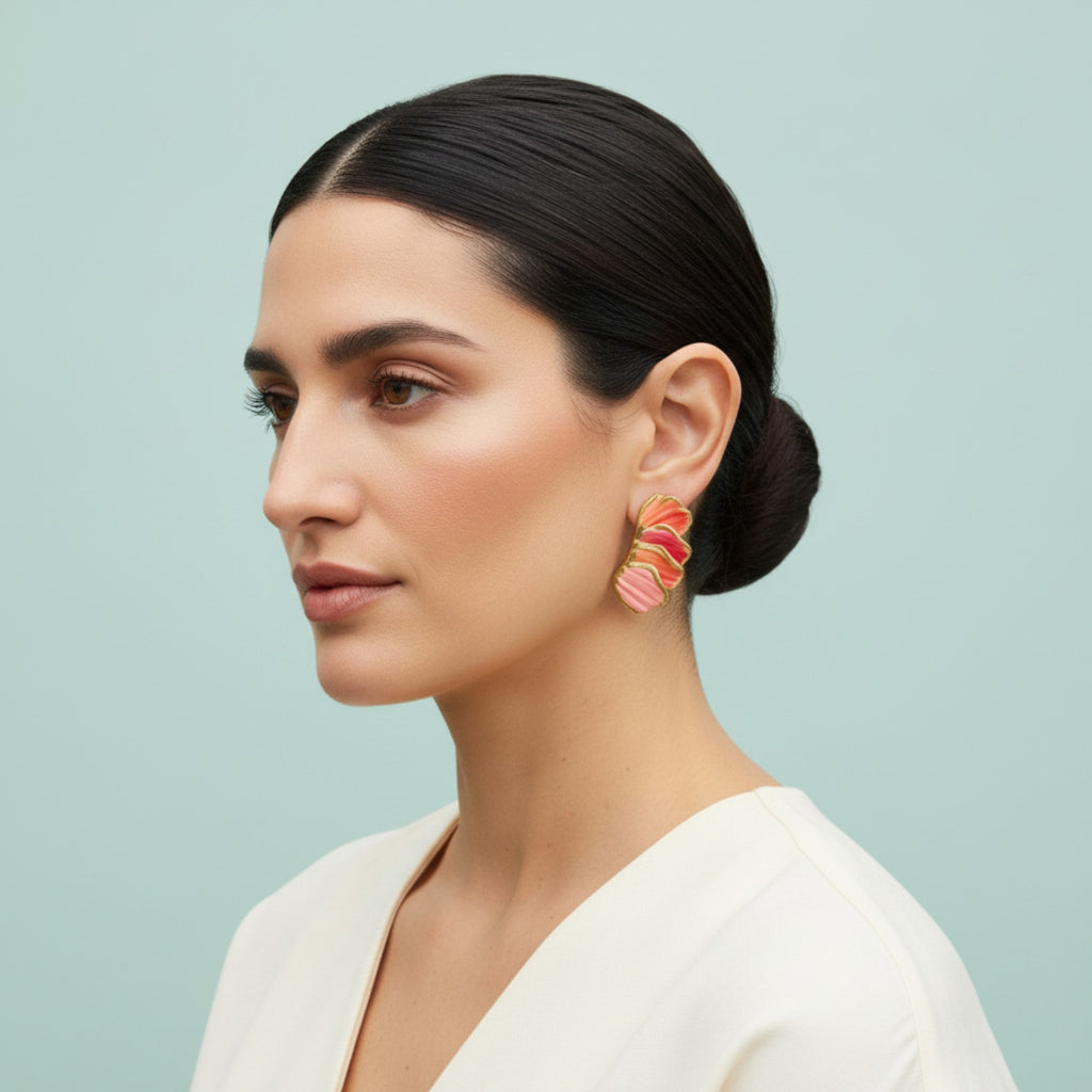 Woman wearing colorful earrings against a light blue background