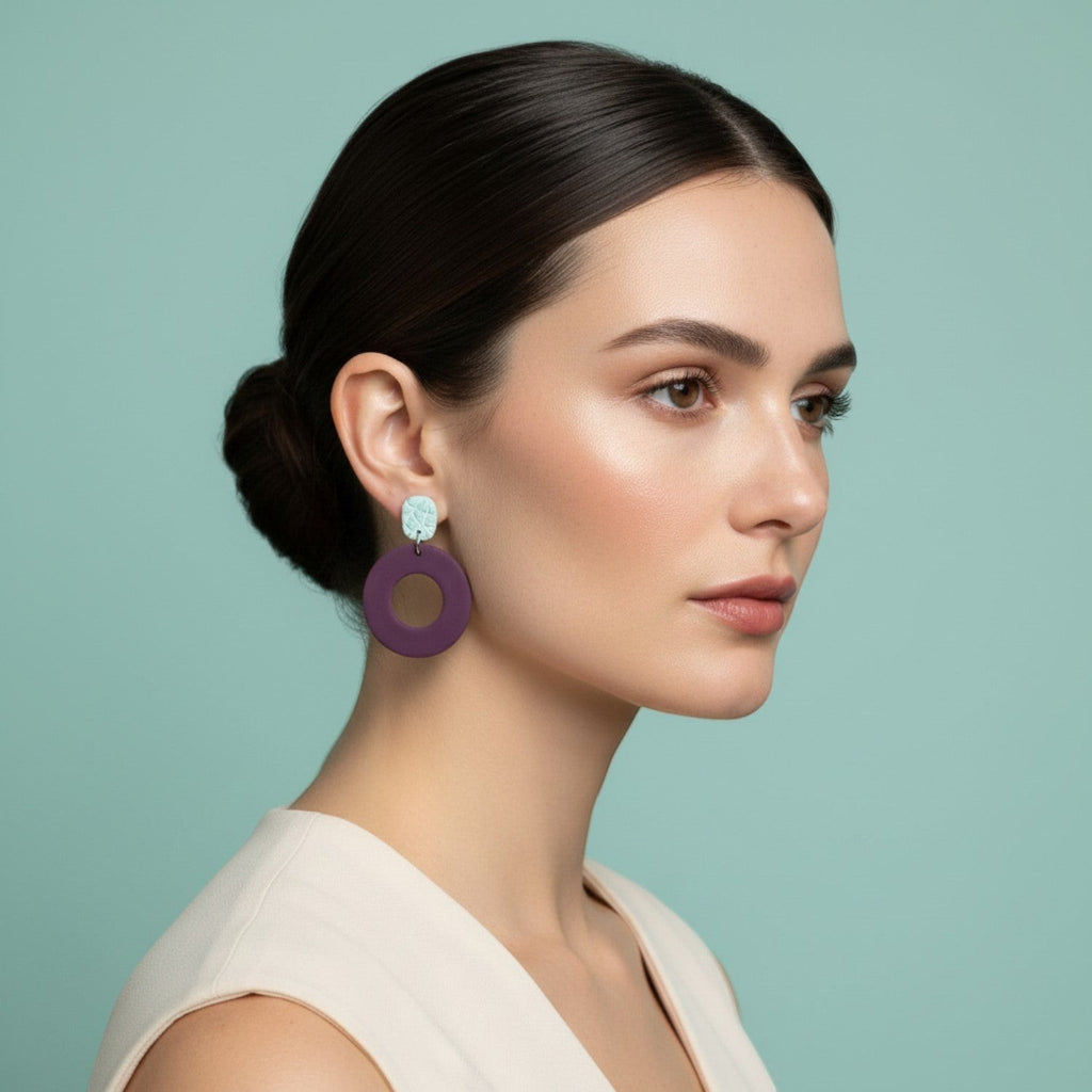 Ziolla Designs plum circular polymer clay earrings with silver leaf-accented studs. Lightweight, nickel-free, and handmade.