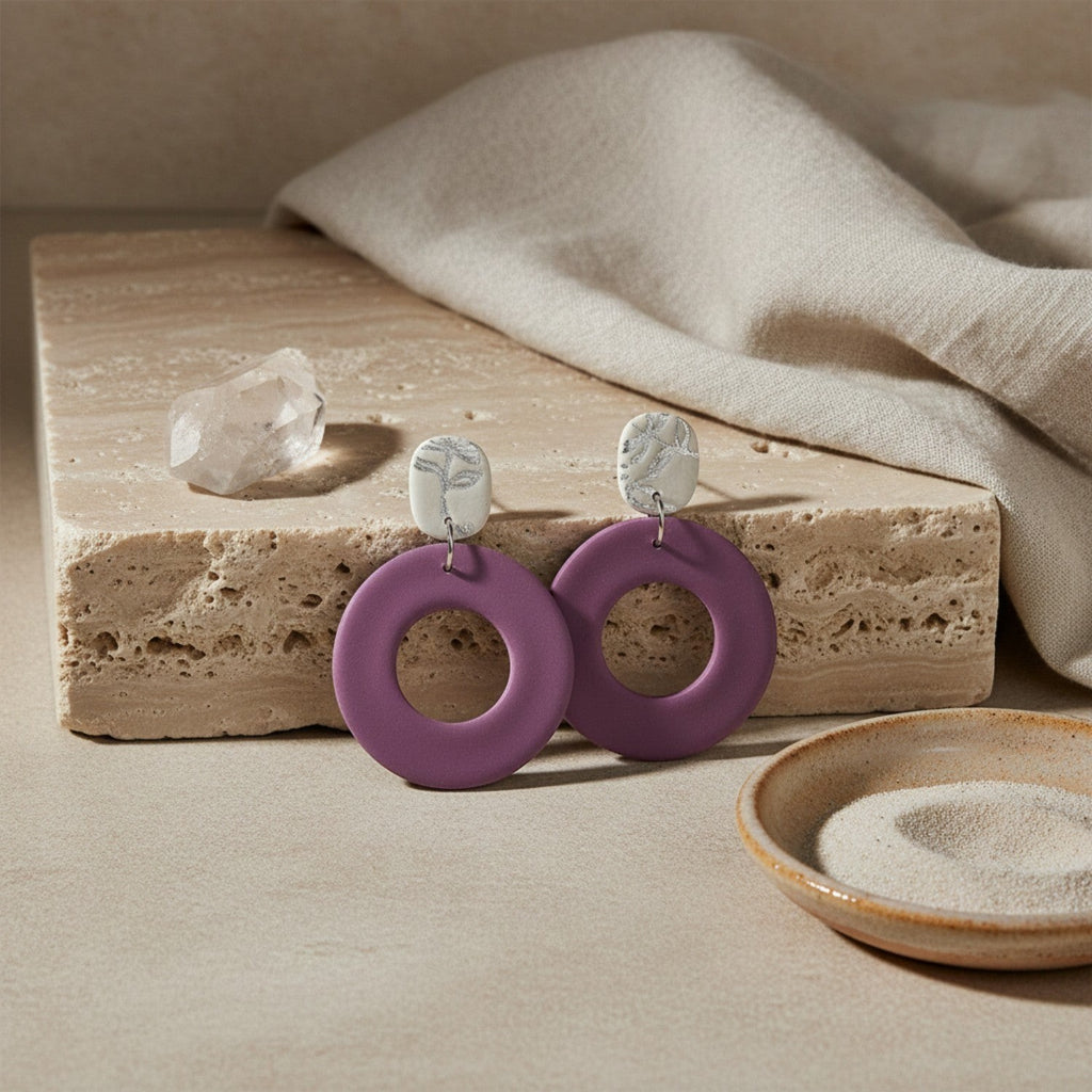 Ziolla Designs plum circular polymer clay earrings with silver leaf-accented studs. Lightweight, handmade, nickel-free.