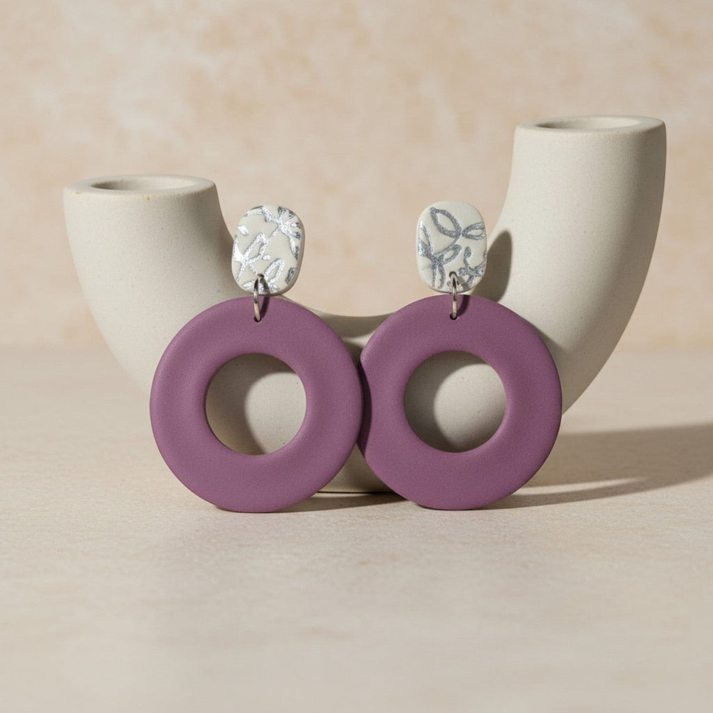 Ziolla Designs plum circular polymer clay earrings with silver leaf-accented studs. Lightweight, nickel-free statement jewellery.