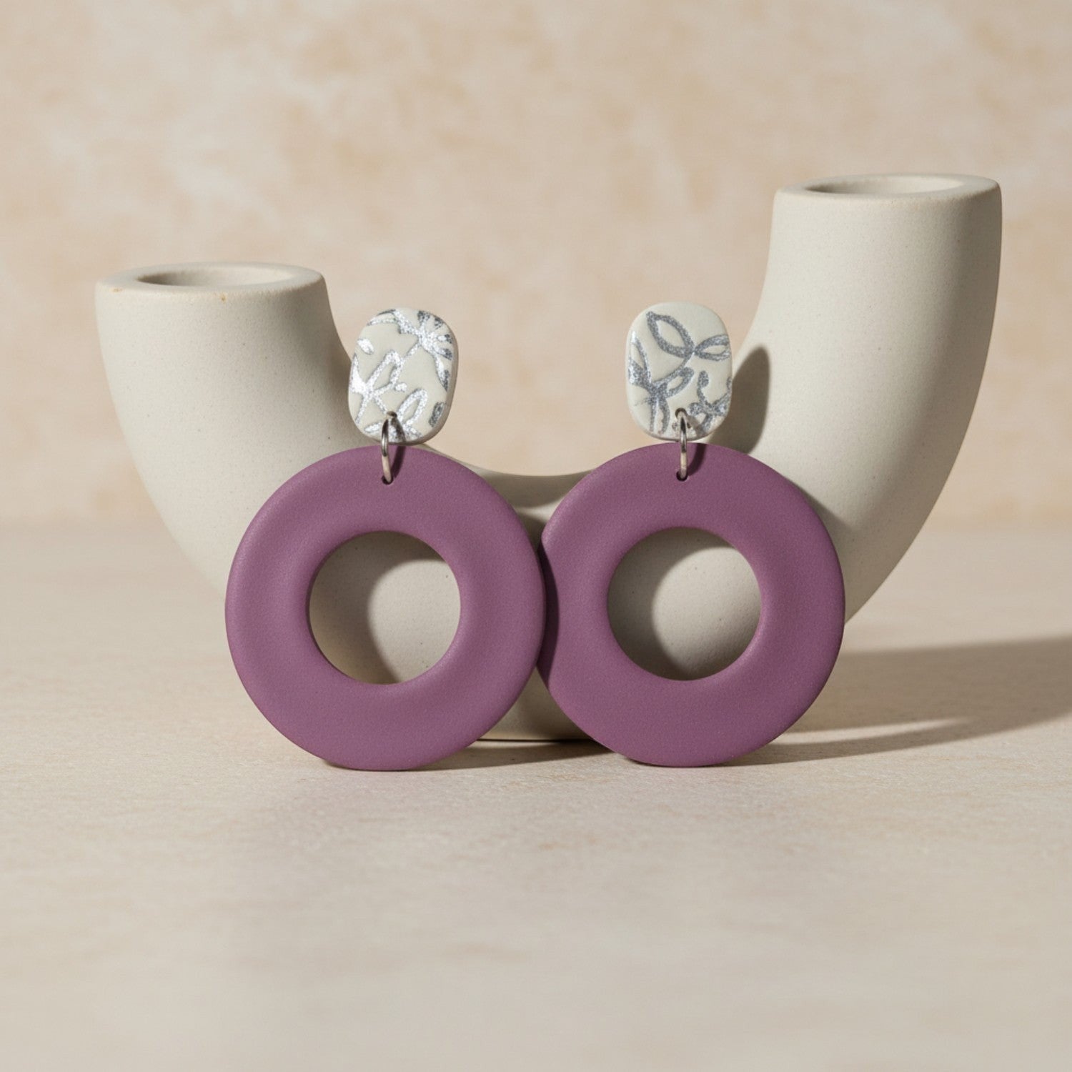 Ziolla Designs plum circular polymer clay earrings with silver leaf-accented studs. Lightweight, nickel-free statement jewellery.