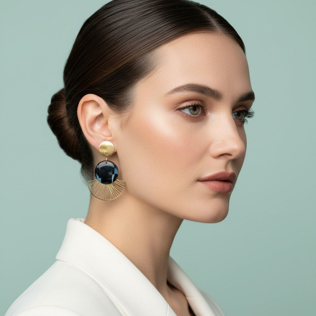 Ziolla Designs Roberta earrings: brushed gold stud, marbled black resin disc, and gold fan detail. Art Deco style.